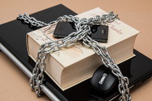 Phone, book, and tablet locked up with a chain